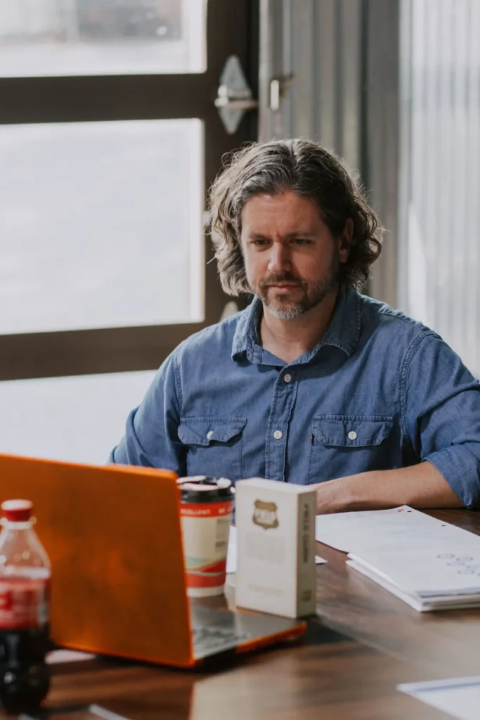 Nathaniel Cooper reading notes at his desk