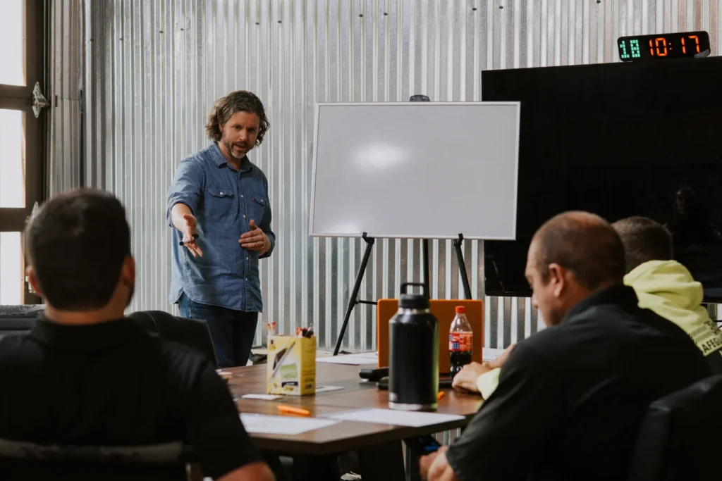 Nathaniel leading a leadership team meeting